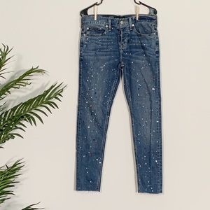 Skinny jeans with color paint splatter detailing